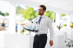 man carrying water at event